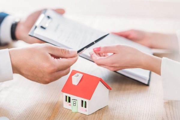 Handing over house keys after closing