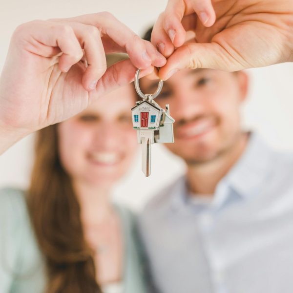 Couple holding house keys after renovation loan approval